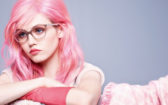 Charlotte Free with pink hair and glasses