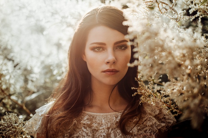 Portrait of a woman with long hair outdoors