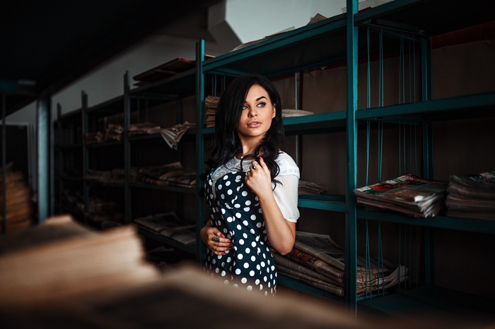 Woman in polka dot dress in archive