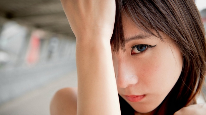 Asian woman with blue eyes and eyeliner
