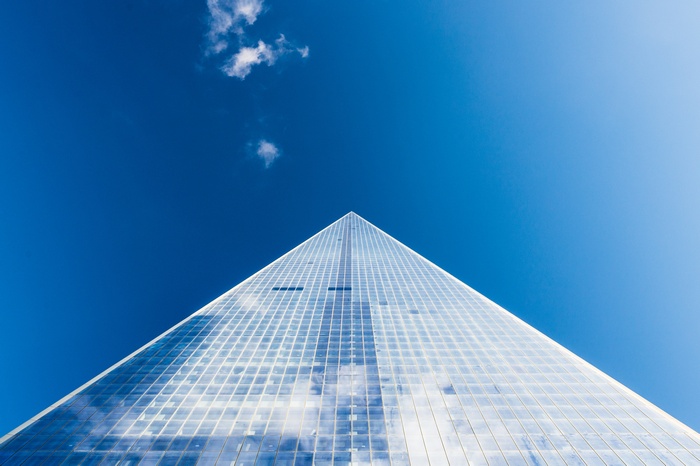Modern skyscraper against a clear blue sky