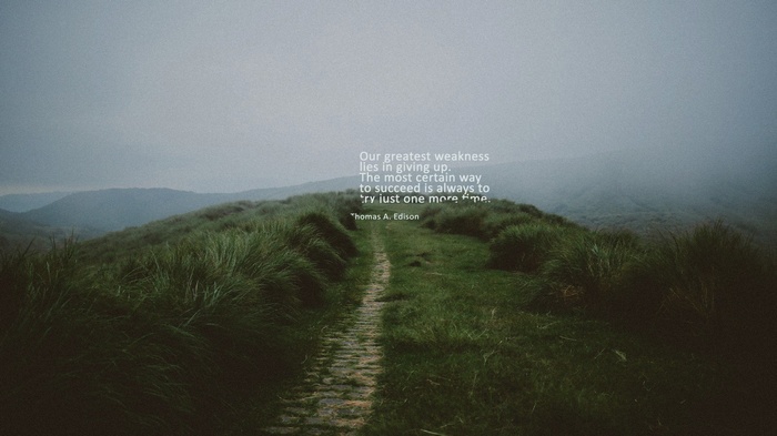 Thomas A. Edison quote on a misty mountain path