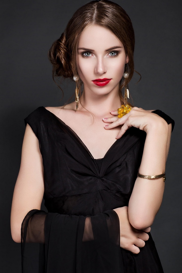 Megan Coffey in a black dress with red lipstick