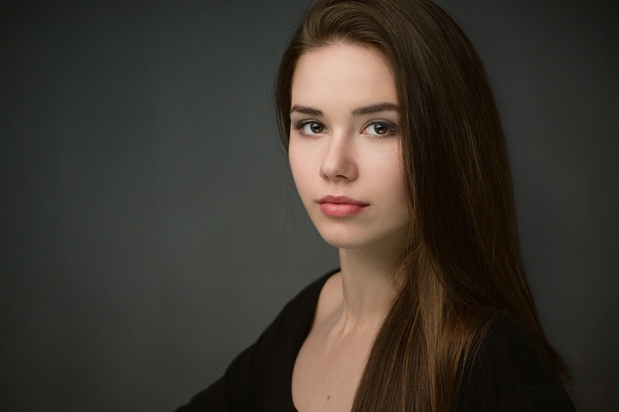 Radina with long brown hair and brown eyes