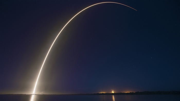Rocket Launch Trail Over Water at Night