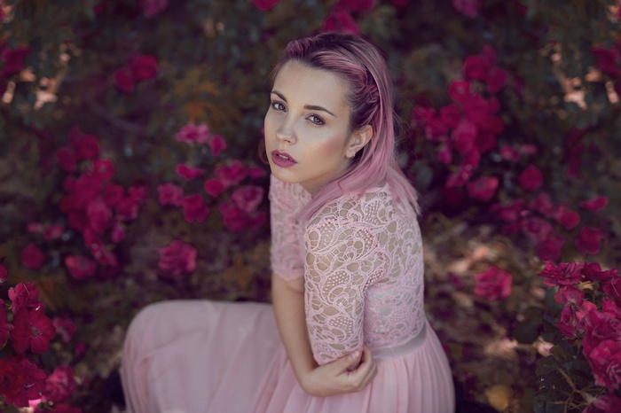 Woman with pink hair in a pink lace dress
