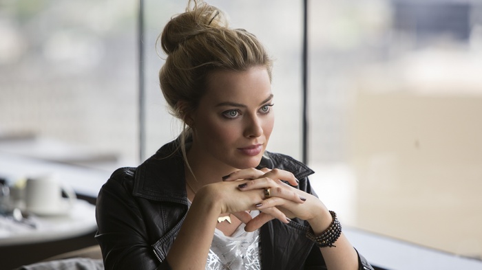 Margot Robbie in a black leather jacket