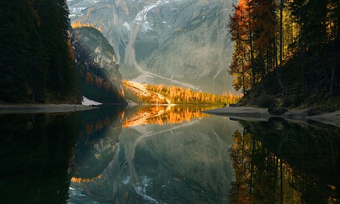 Autumn forest reflects in a mountain lake