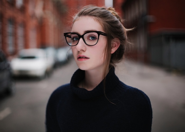 Katerina Gorodkova wearing glasses and a sweater