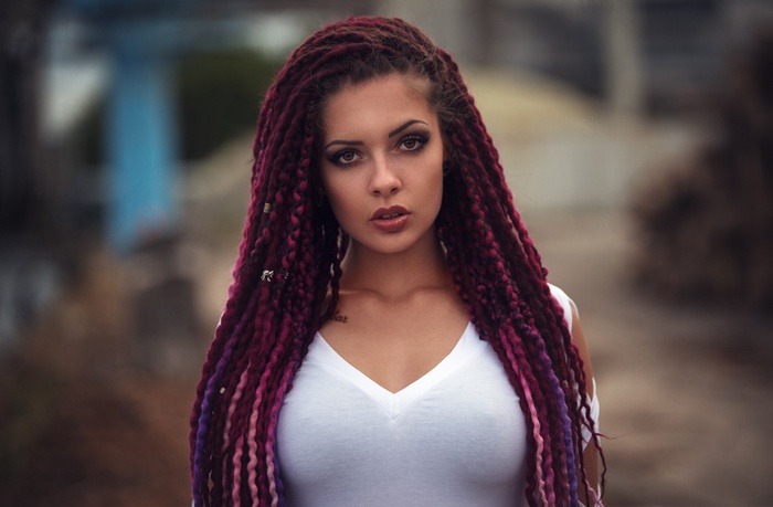 Woman with long dyed dreadlocks