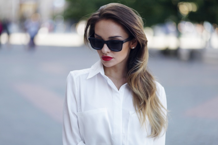 Sylwia Nowak wearing sunglasses and a white shirt