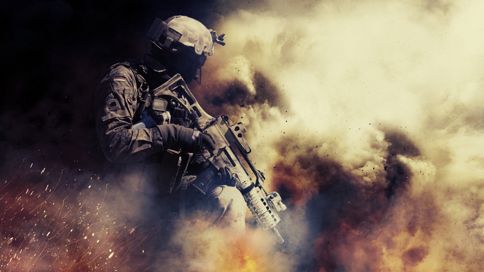 Soldier with G36 rifle in smoke and fire