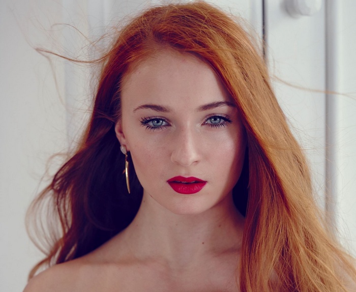 Sophie Turner portrait with red hair and red lipstick