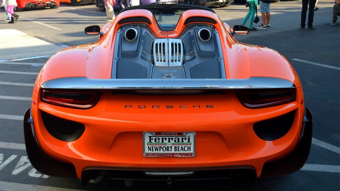 Rear view of an orange Porsche 918 Spyder