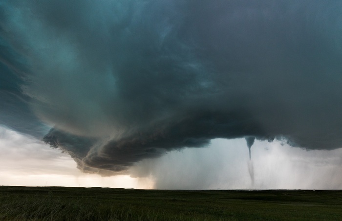 Tornado in Montana over a grassy field
