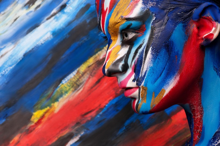 Woman with colorful body paint in profile
