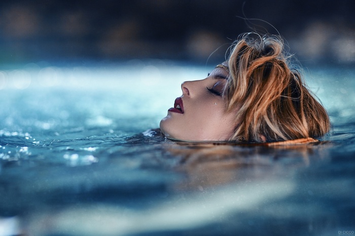 Woman with closed eyes in water by Alessandro Di Cicco