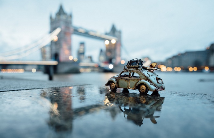 Toy car with luggage in front of Tower Bridge, London