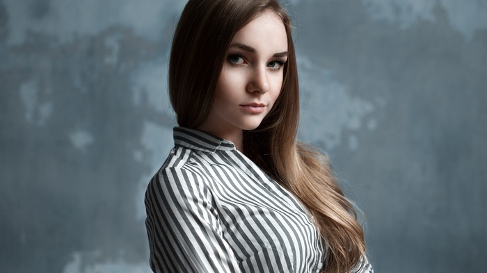 Portrait of a young woman in a striped shirt