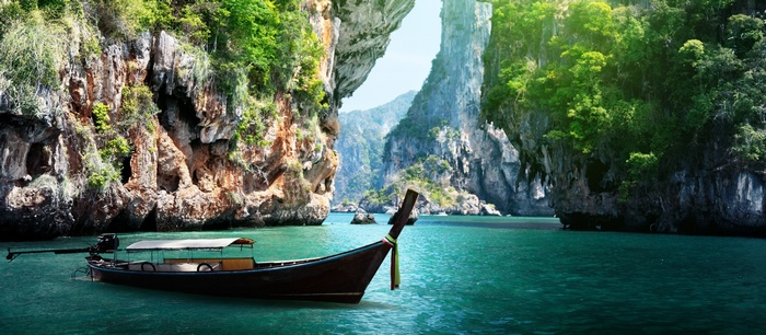 Longtail boat in a tropical cove in Thailand
