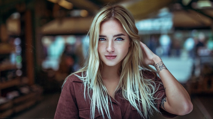 Woman with blonde hair and blue eyes