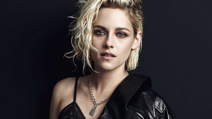 Kristen Stewart in a black lace top and leather jacket