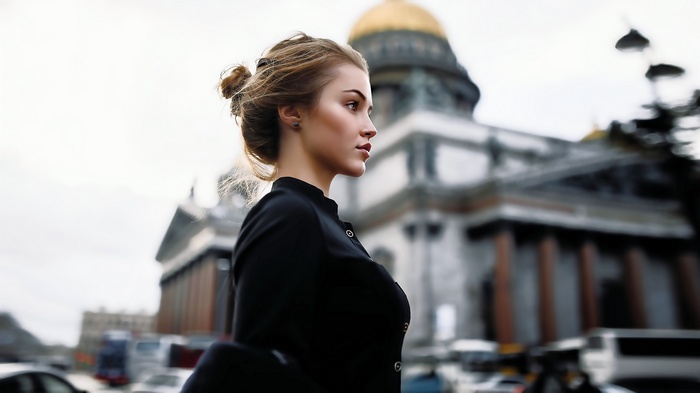 Woman in black in front of St. Petersburg building
