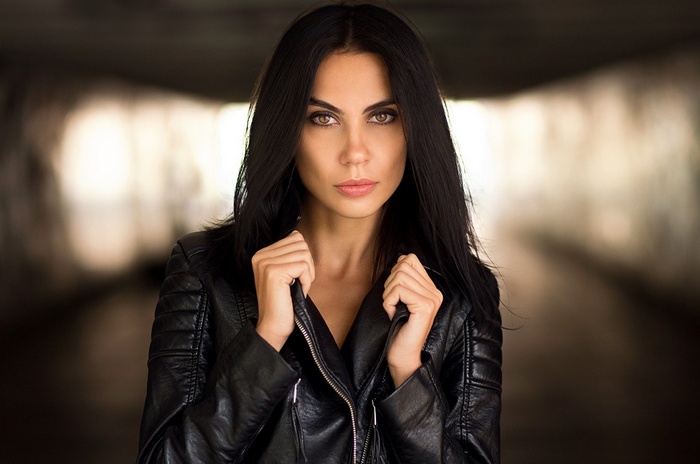 Woman in a black leather jacket