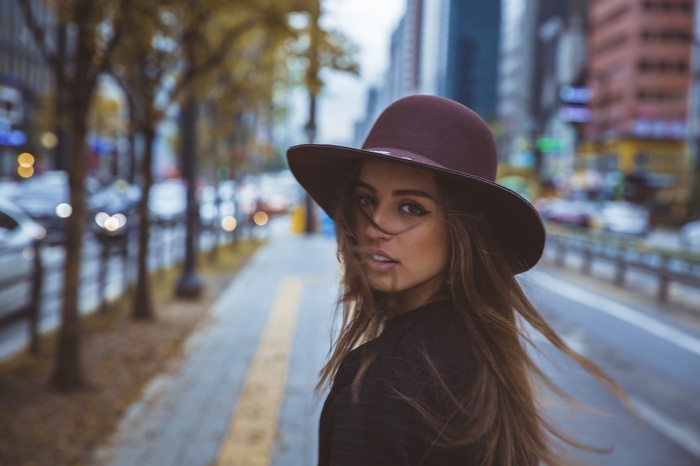 Sasha Blaze wearing a hat in a city