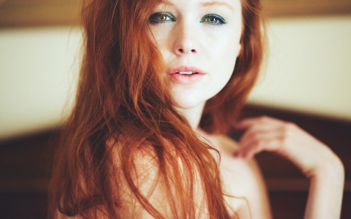 Redhead woman with long hair and makeup