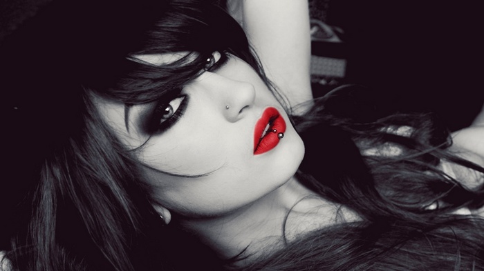 Niky Von Macabre with red lips and piercings