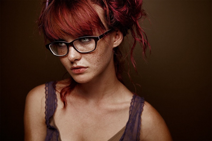 Kacy Anne Hill with red hair and glasses