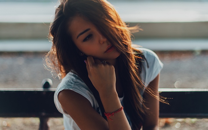 Asian woman with long hair in sunlight