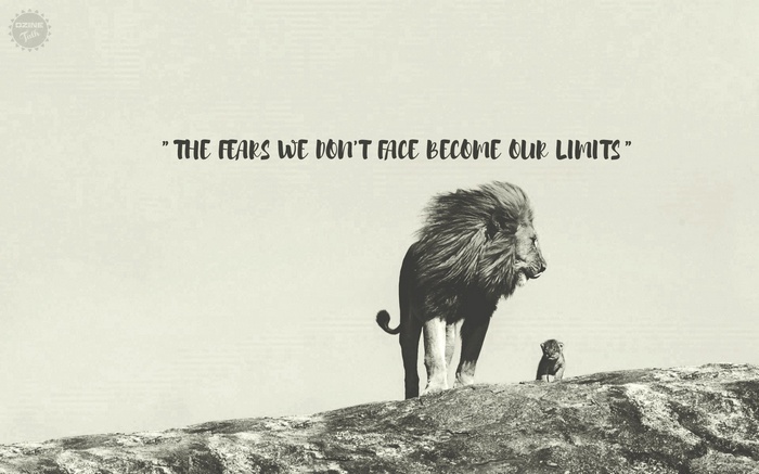 Lion and cub on a rock with motivational quote