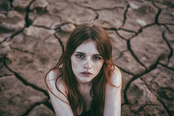 Woman with freckles looking at the camera
