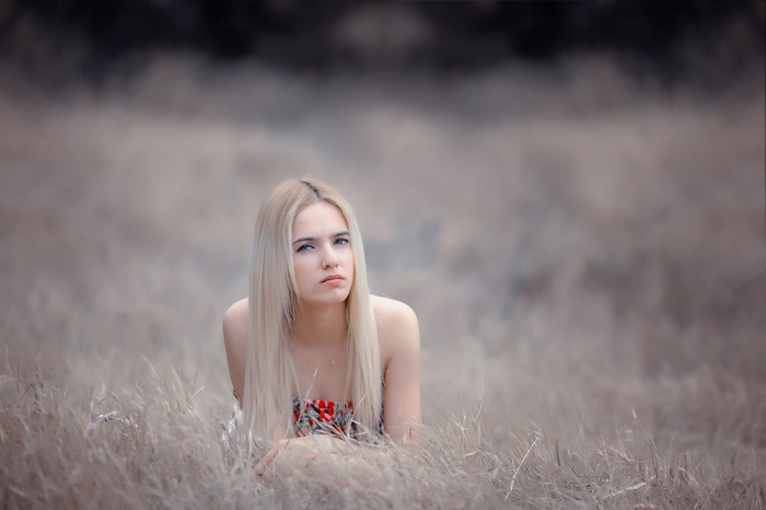 Sarah Summers in a field of dry grass
