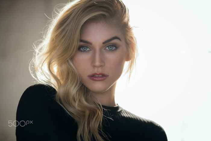 Woman with blonde hair and blue eyes