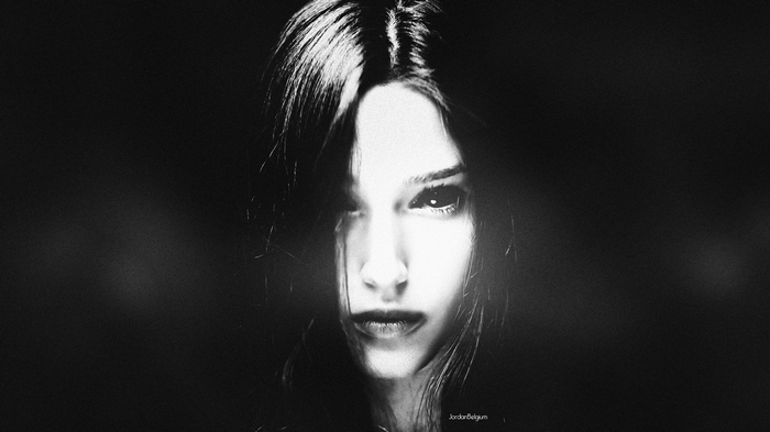 Monochrome portrait of a woman with dark eyes