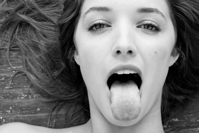 Alyssa Arce sticking her tongue out