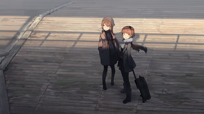 Two girls with luggage on a wooden platform