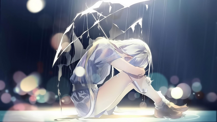 Girl crying under a broken umbrella in the rain