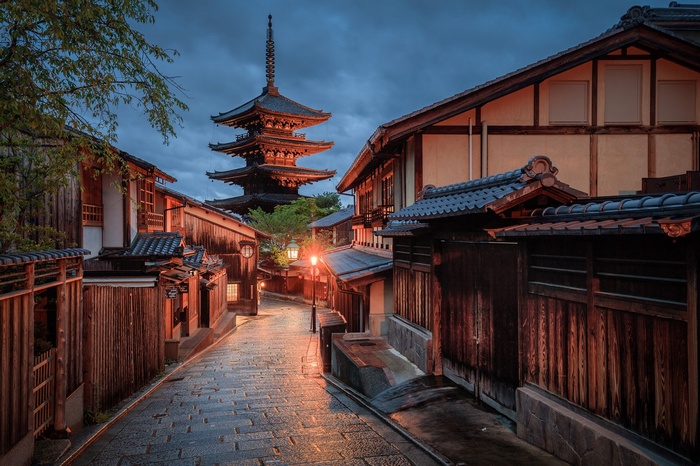 Traditional Japanese street with pagoda at dusk
