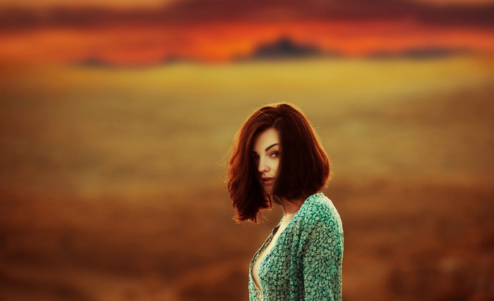 Woman with short brown hair looking at viewer