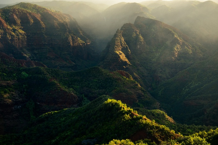Green mountains landscape with sunlit peaks