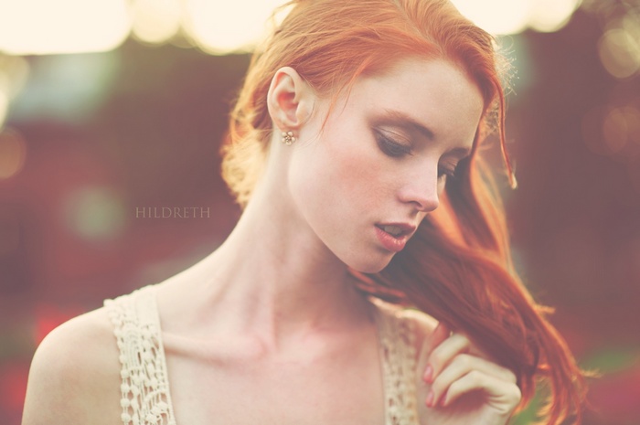 Charles Hildreth, a redhead woman with makeup