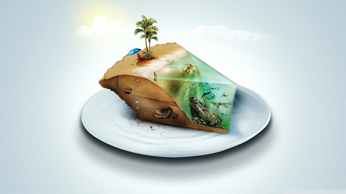 A slice of cake with a tropical island and underwater scene