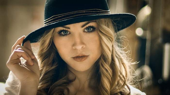 Sofie Elena wearing a black hat and looking at viewer
