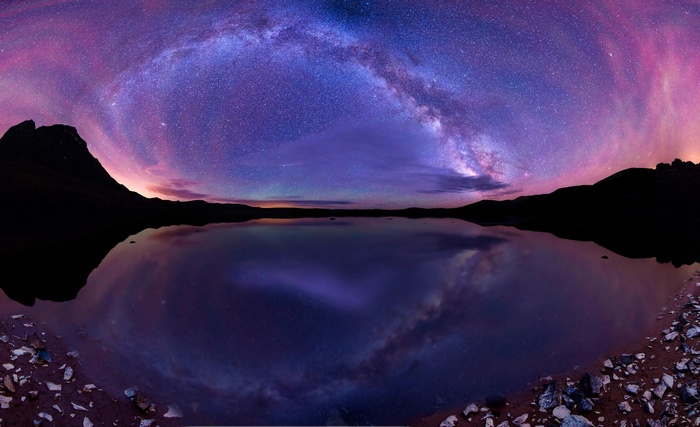 Milky Way reflected in a lake at night