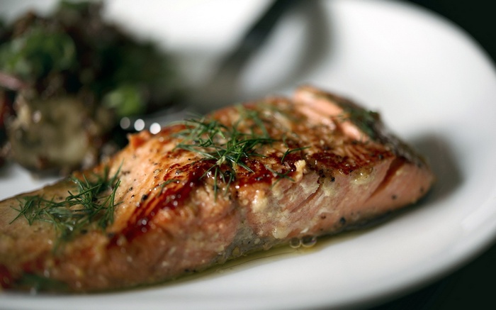 Cooked salmon fillet with dill and side dish