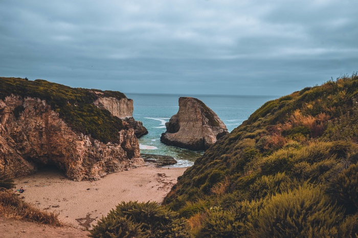 Rocky cliffs and a beach by the sea